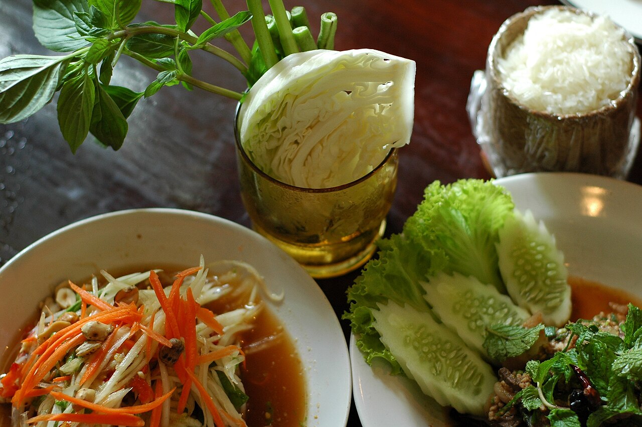 Lao papaya salad, larb, and sticky rice with fresh herbs